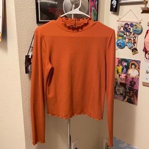 Burnt orange turtle neck